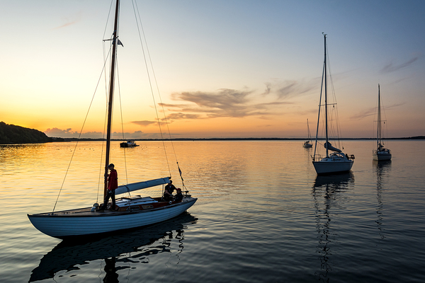 Sailing boats coming back into the harbour during scenic sunset at the Baltic Sea in Northern Germany Digital Download