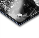 Black and white street photo of people walking down the road seen through the spokes of a bicycle Acrylic print