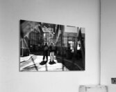 Black and white street photo of people walking down the road seen through the spokes of a bicycle Acrylic Print