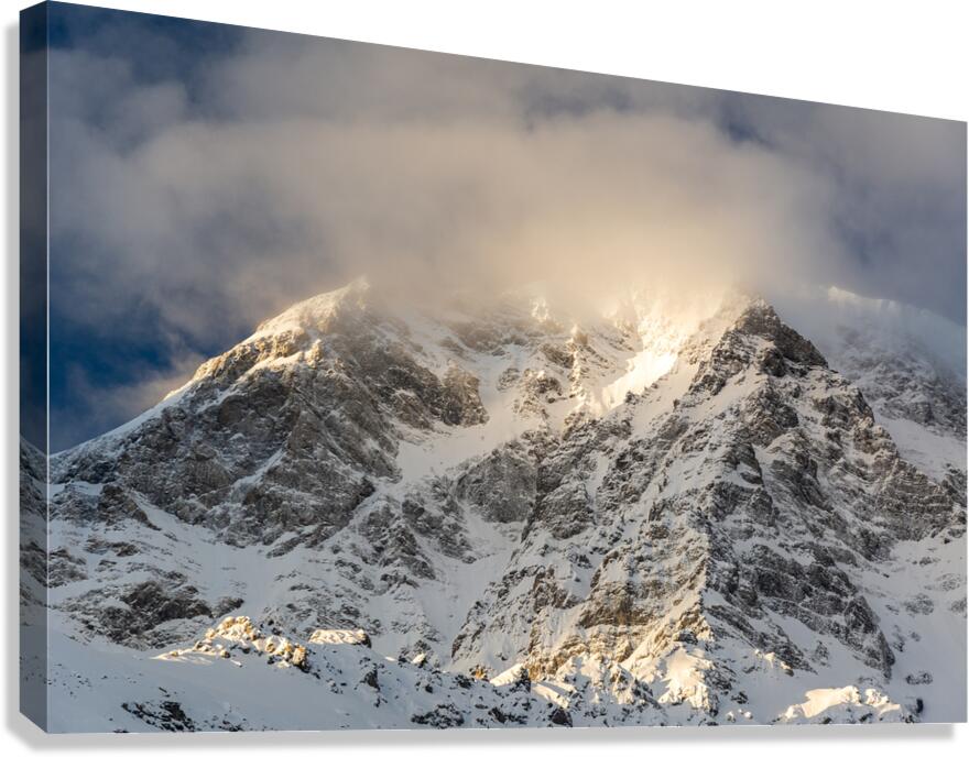 Sun rays shining through the clouds on a gorgeous morning at the Ortler Mountain in South Tyrol  Canvas Print