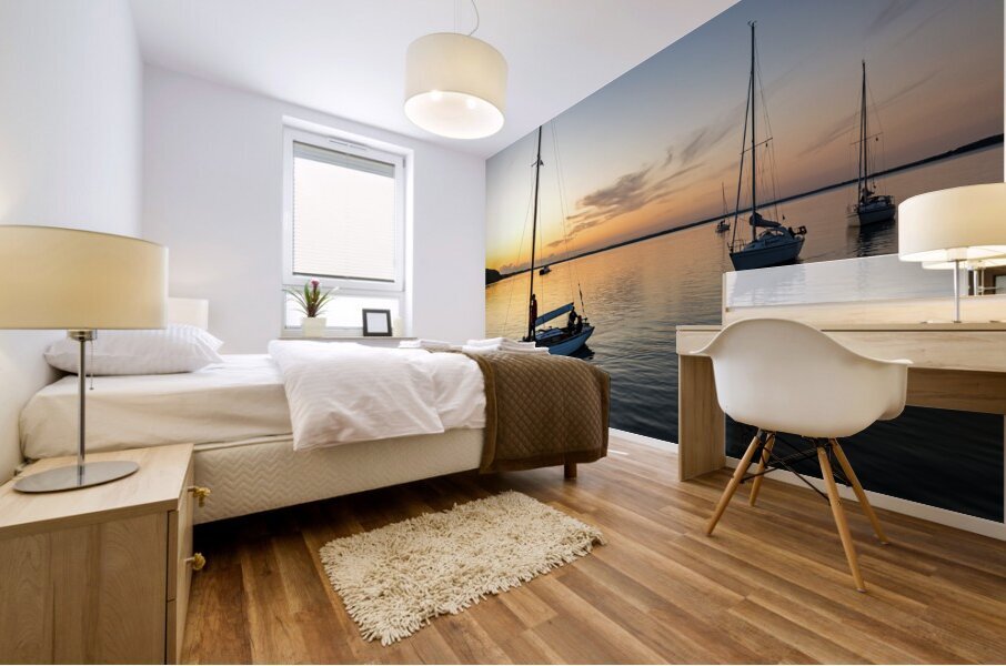 Sailing boats coming back into the harbour during scenic sunset at the Baltic Sea in Northern Germany Mural print