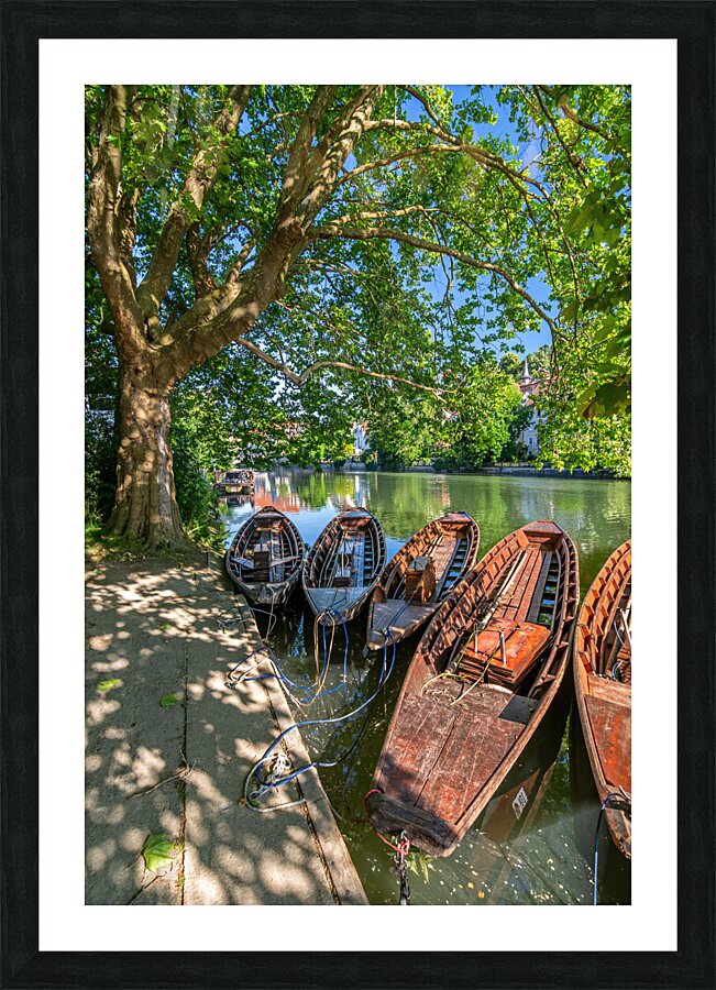Traditional punt boats Stocherkahn at the pier at the Neckar River in Tübingen Germany Picture Frame print