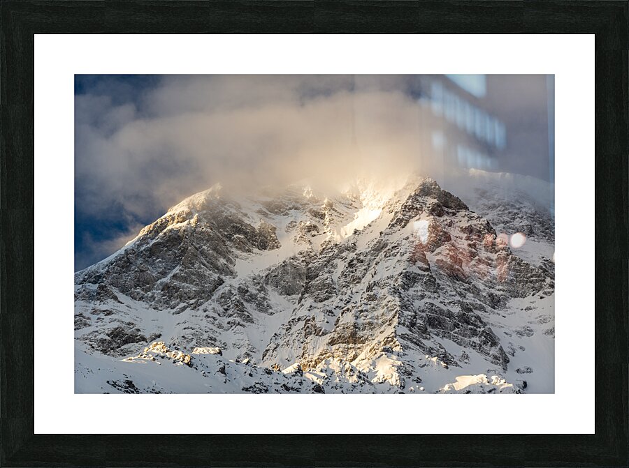 Sun rays shining through the clouds on a gorgeous morning at the Ortler Mountain in South Tyrol  Picture Frame print