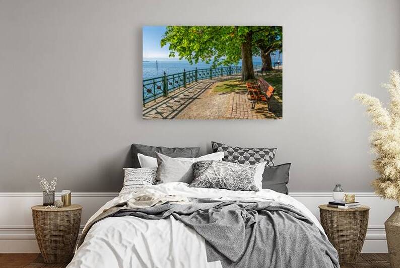 Bench at idyllic promenade in Friedrichshafen at Lake Constance in Southern Germany  by caladoart