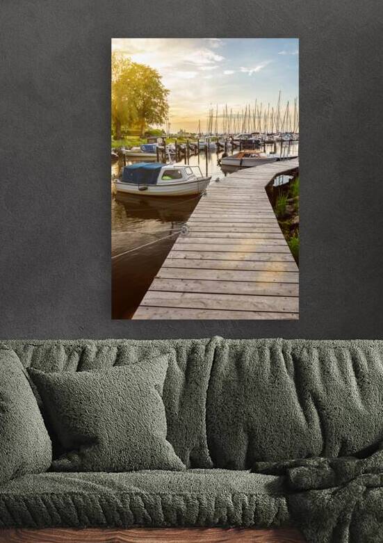 Boats at the pier of Langballigau during beautiful sunset at the Baltic Sea in Northern Germany by caladoart