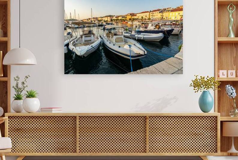 Boats at sunset in the marina of Mali on the island of Losinj in the Adriatic Sea Croatia by caladoart