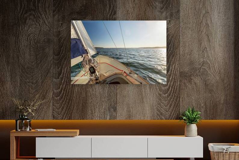 View from a sailing yacht sailing on the Baltic Sea during beautiful sunset  by caladoart