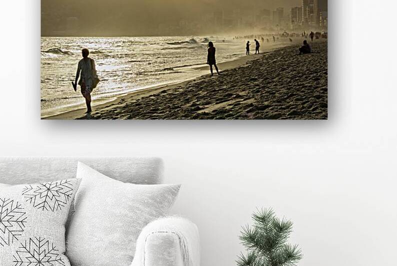 People walking at Ipanema Beach in Rio de Janeiro in Brazil at sunset   by caladoart