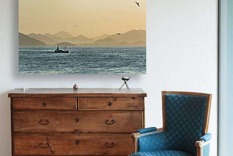 Fishing boat and seagulls on the Atlantic Ocean at sunrise in Rio de Janeiro in Brazil  by caladoart