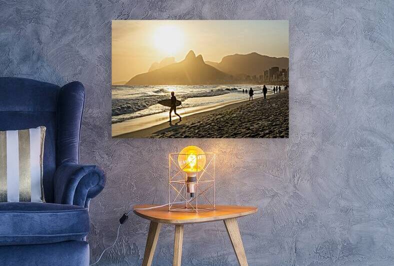 Surfer at Ipanema Beach in Rio de Janeiro in Brazil at sundown by caladoart
