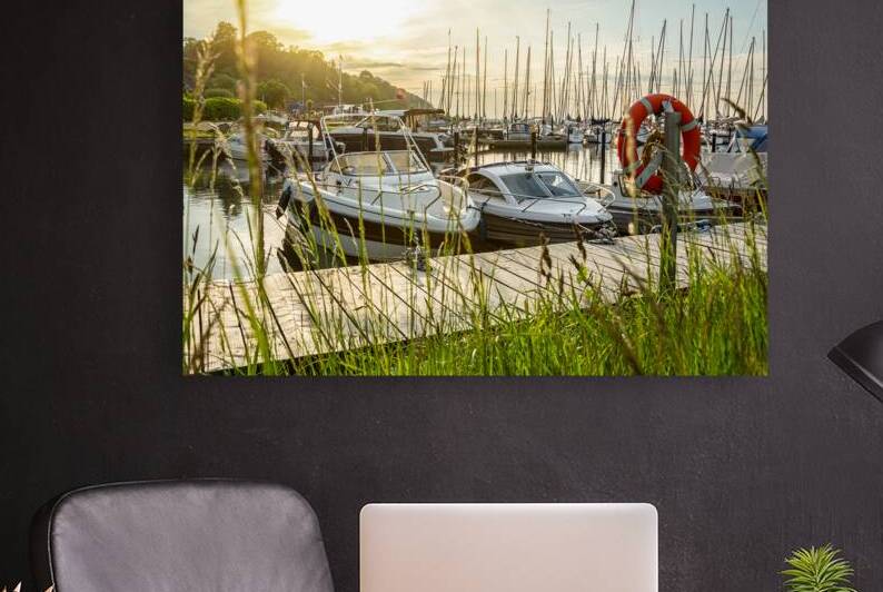 Sunset over pier and marina in Langballigau at the Baltic Sea in Northern Germany by caladoart