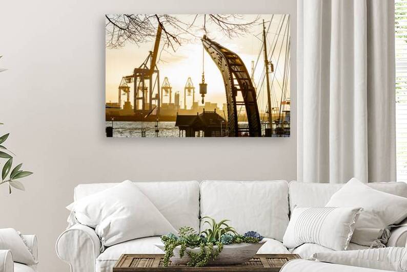 Historic crane at the old harbor in Hamburg Övelgönne at the Elbe River at sunset by caladoart