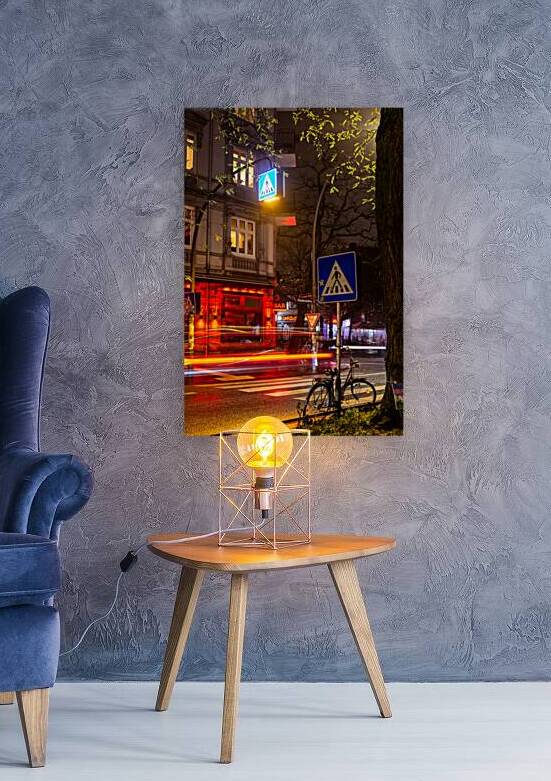 Long exposure night shot of a colourfully lit up street in Hamburg Altona by caladoart