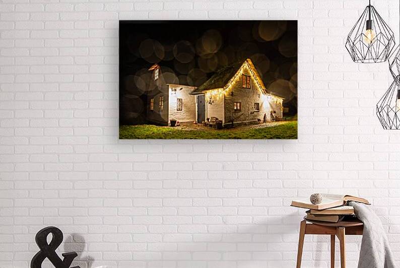 Charmingly illuminated cosy traditional thatched roof house in Northern Germany at night  by caladoart