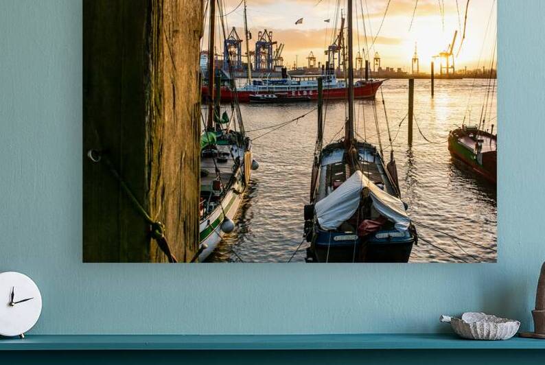 Historic boats in the old harbor in Hamburg Övelgönne at the Elbe River at sunset  by caladoart