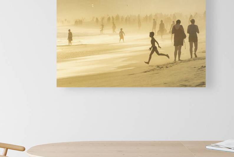 Boy running towards the ocean at Ipanema Beach in Rio de Janeiro during dramatic sunset by caladoart