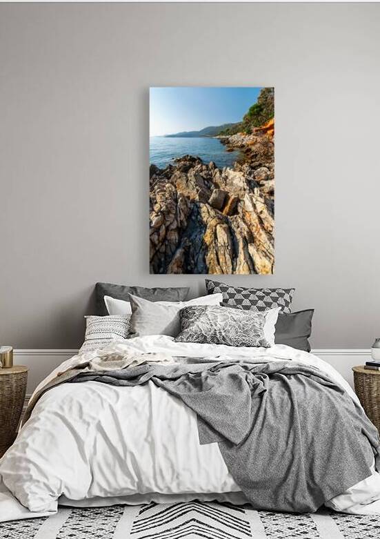 Scenic rock formations in a beautiful bay at the Adriatic sea on the island of Losinj in Croatia by caladoart