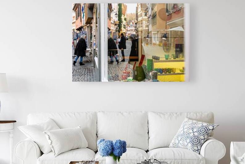 Street photo of reflections of people window shopping in the city  by caladoart