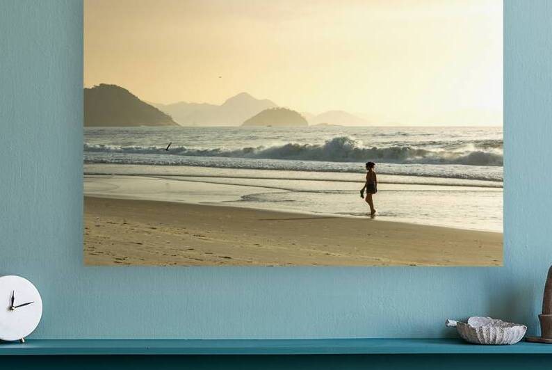 Woman strolling along Copacabana Beach in Rio de Janeiro in Brazil at sunrise  by caladoart