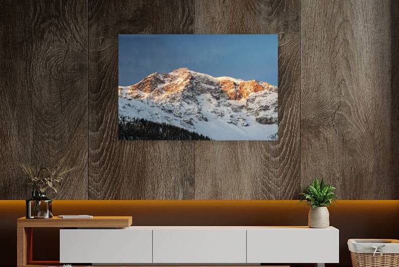 Orange light of the sunrise reaching the top of the Ortler Mountain in South Tyrol  by caladoart