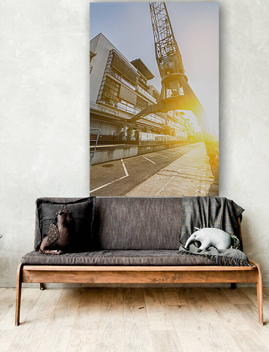 Sunrise under a historic harbor crane in Hamburg Germany by caladoart