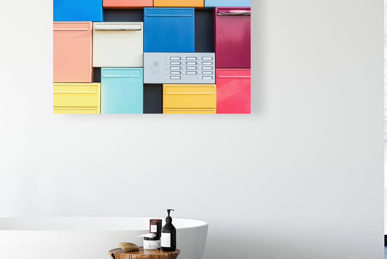 Closeup view of colorful mailboxes by caladoart