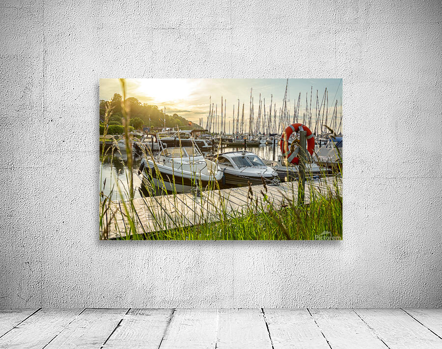 Sunset over pier and marina in Langballigau at the Baltic Sea in Northern Germany Wall Preview