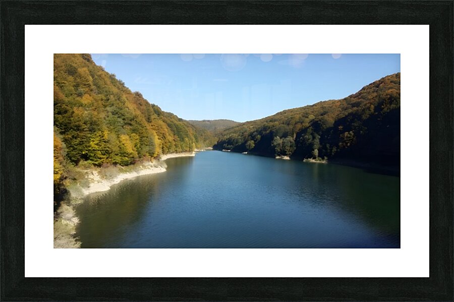 A stunning landscape of mountains trees and green leaves with water - Romania Picture Frame print