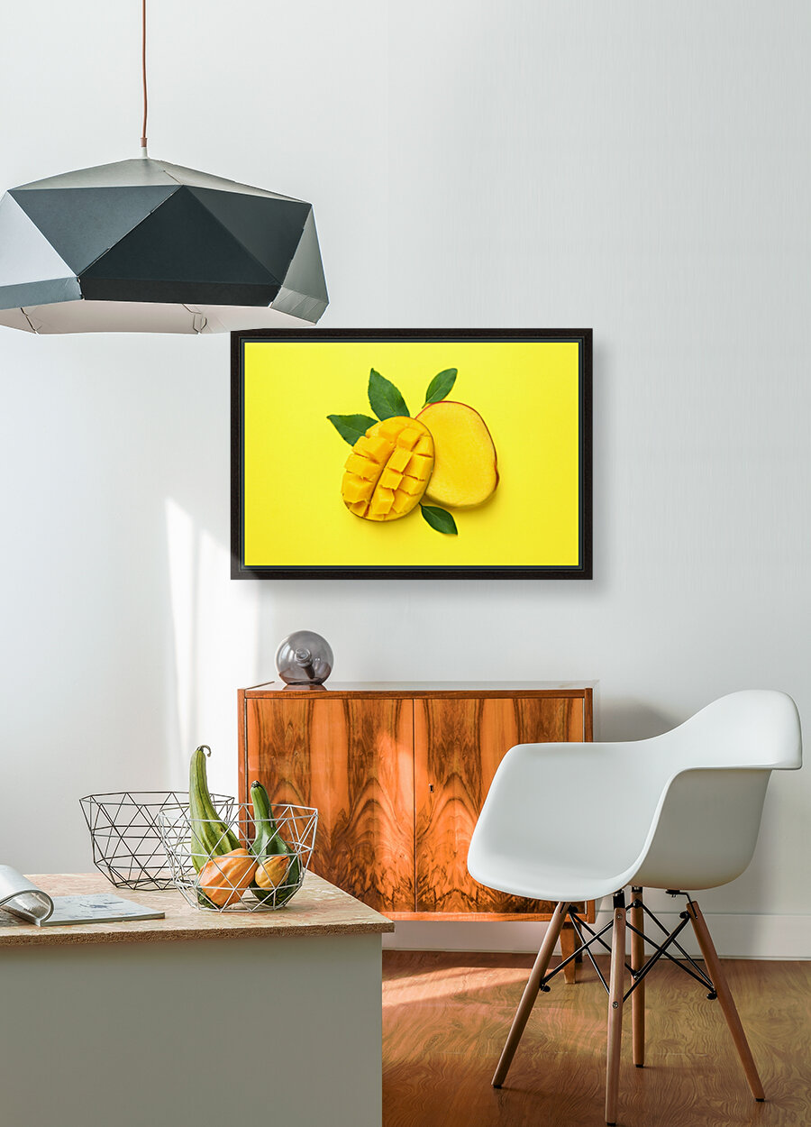 ripe mango fruit yellow background close up Reproduction