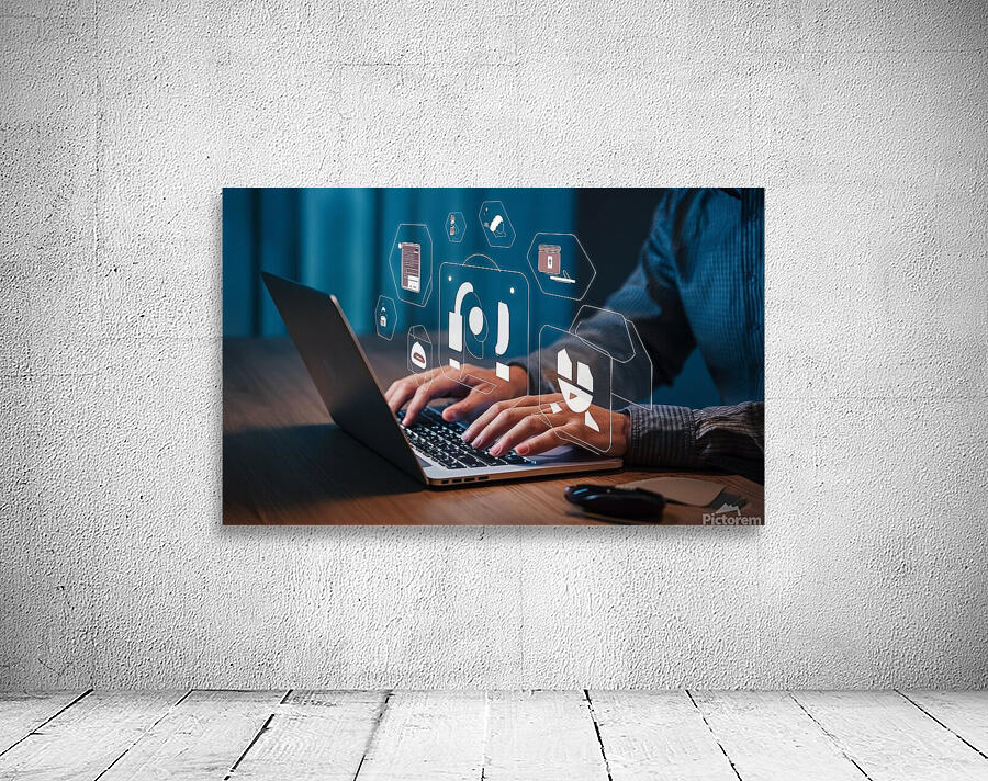 a person using a laptop at a table a stock photo Wall Preview