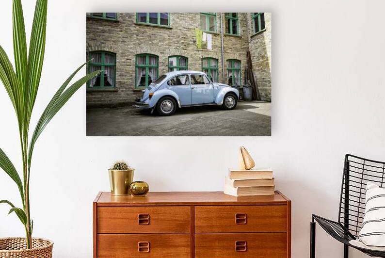 Retro Blue Classic Car Parked Beside Brick Building by Chris Willemsen