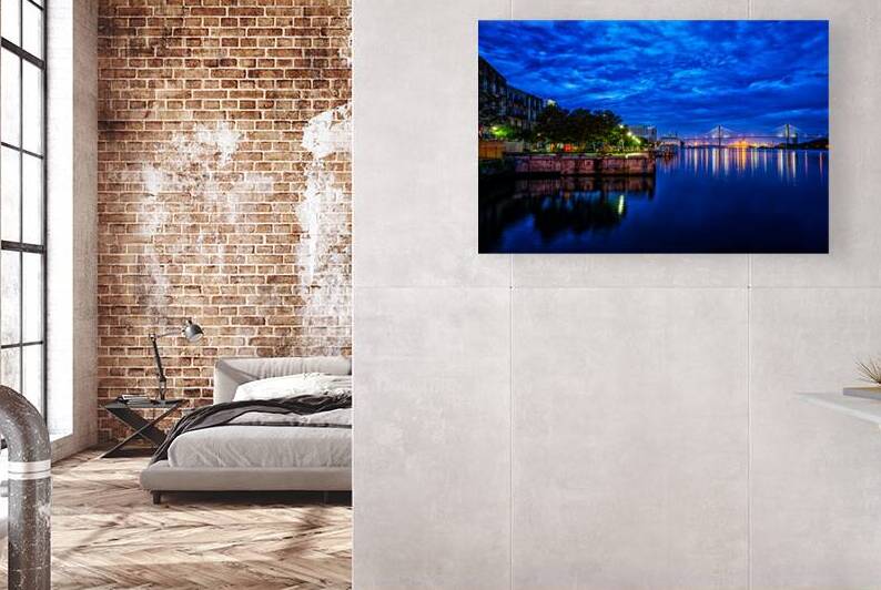 Savannah riverfront and bridge at dusk with vibrant lights by Gestalt Imagery