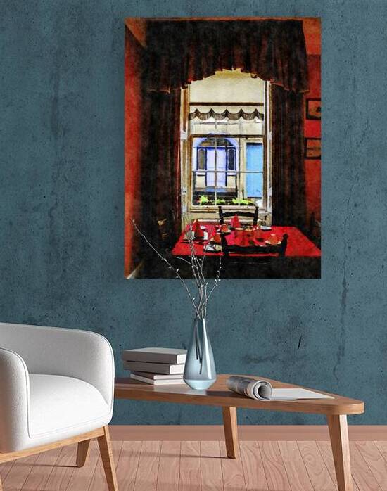 Cozy dining room with red table setting and window view by Gestalt Imagery
