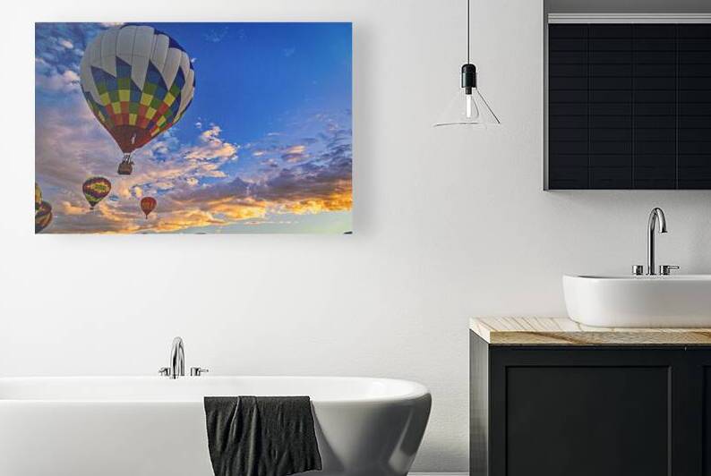 Colorful hot air balloons soaring during a picturesque sunrise by Gestalt Imagery