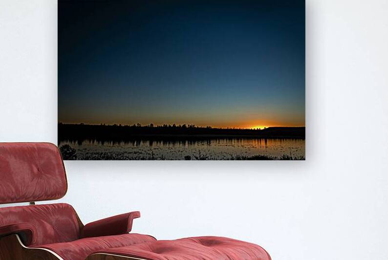Scenic sunset over a tranquil lake with mirrored reflections and by Gestalt Imagery