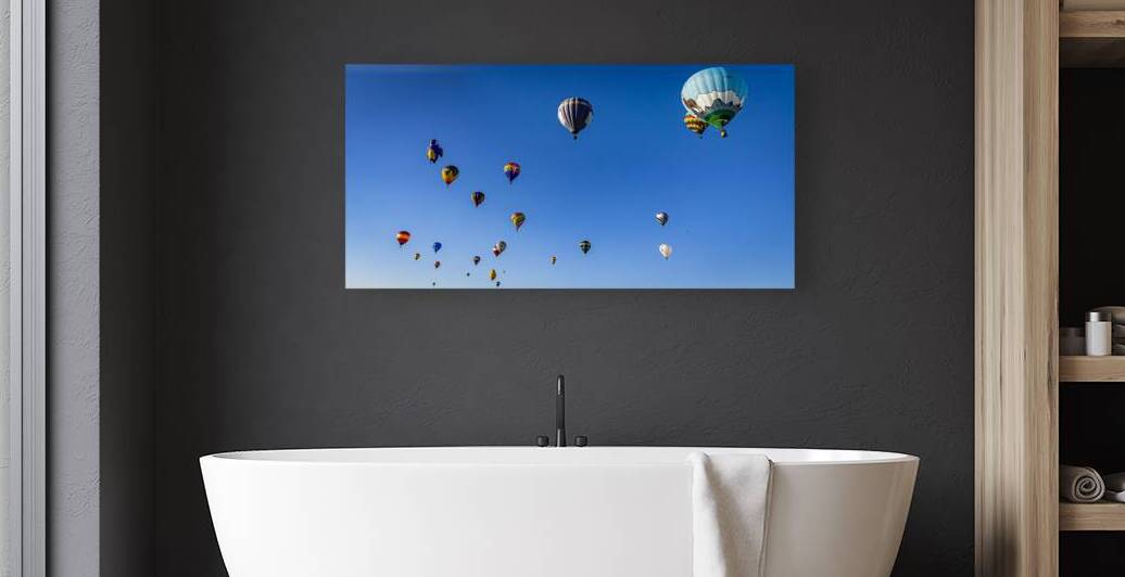 Hot air balloons soaring against a vibrant blue sky in a colorfu by Gestalt Imagery