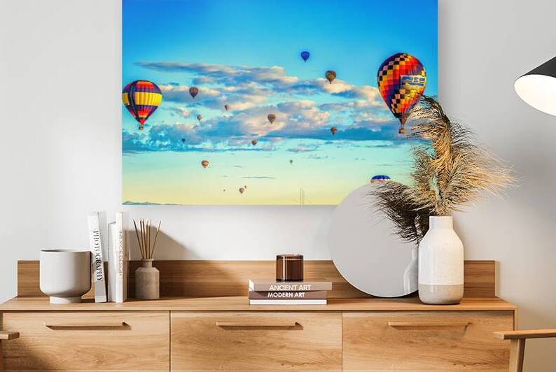 Hot Air Balloons Floating in Blue Cloudy Sky by Gestalt Imagery