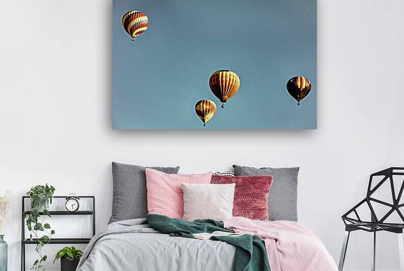 Hot Air Balloons Floating in Blue Clear Sky by Gestalt Imagery