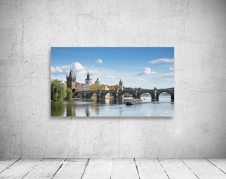 Touristic boat near the Charles bridge in Prague. Wall Preview