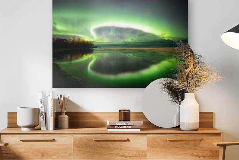 Radiant Northern Lights casting ethereal hues over a frozen Pinehouse Lake Saskatchewan. Captured by Dre Erwin this celestial dance illuminates the wintry night sky painting an awe-inspiring spectacle of natures brilliance by Dre Erwin Photography