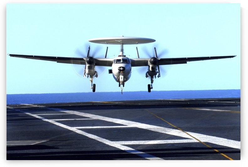 An E-2C Hawkeye approaches for landing aboard USS John C Stennis. by StocktrekImages