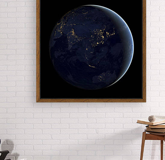 Full Earth at night showing city lights of Asia and Australia.  by StocktrekImages