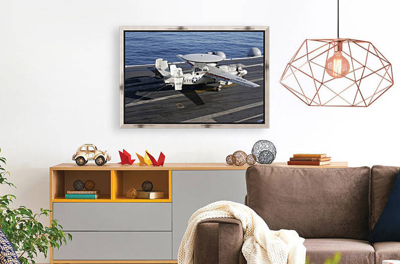 An E-2C Hawkeye makes a successful arrested landing aboard USS Kitty Hawk. by StocktrekImages