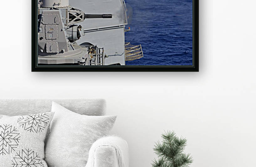 USS Monterey fires a close-in weapons system. by StocktrekImages