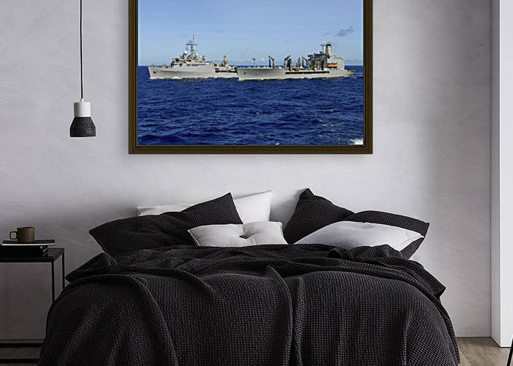 USS Denver and USNS Pecos conduct a replenishment at sea. by StocktrekImages