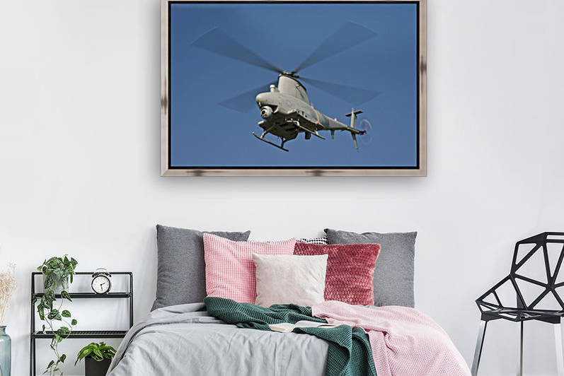 An MQ-8B Fire Scout unmanned aerial vehicle in flight. by StocktrekImages