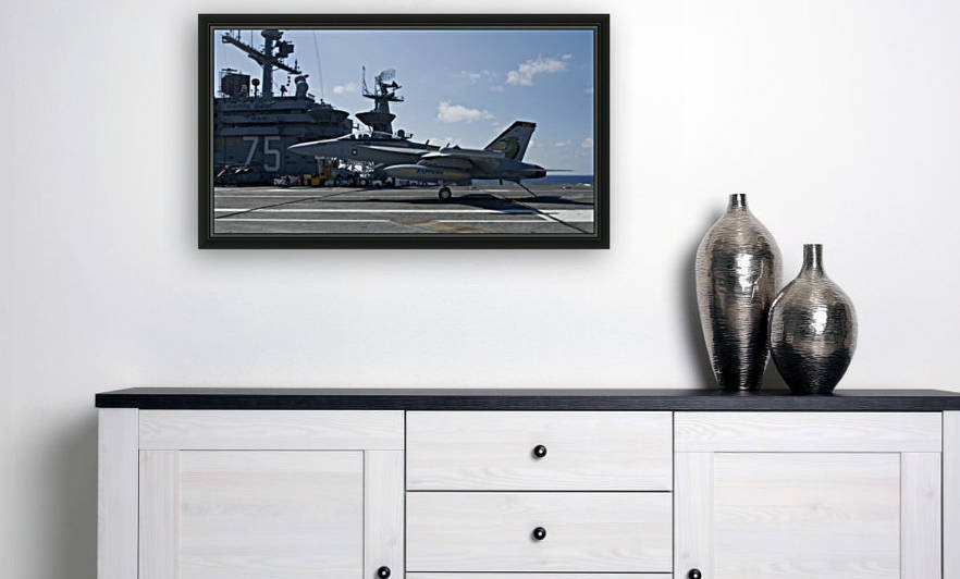 An EA-18G Growler lands aboard the aircraft carrier USS Harry S. Truman. by StocktrekImages