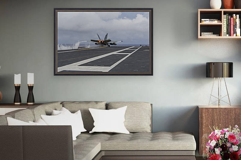 An F-A-18E Super Hornet takes off from the flight deck of USS George Washington. by StocktrekImages