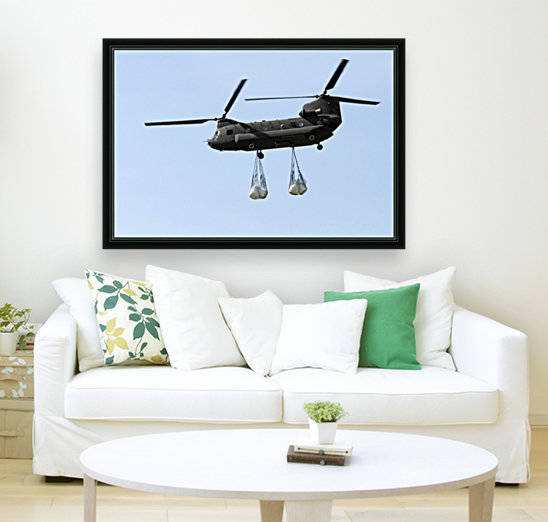 A CH-47 Chinook carrying sandbags. by StocktrekImages