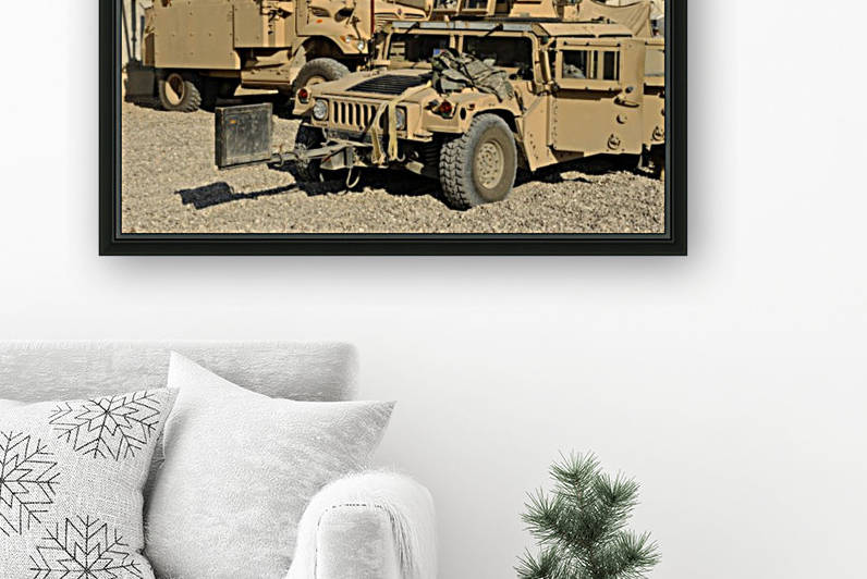 A M1114 humvee sits parked in front of a MaxxPro MRAP. by StocktrekImages